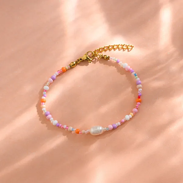 PERLENARMBAND rosa/lila inklusive gestreiftem STOFFBEUTEL mit gesticktem HERZ